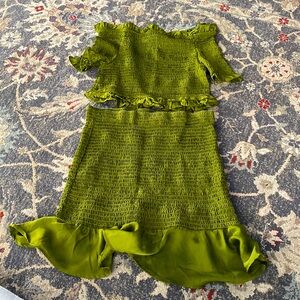 Green off the shoulder crop top and mini skirt set